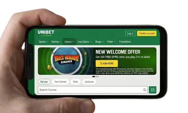 Hand holding a smartphone displaying the Unibet mobile casino website in landscape view.